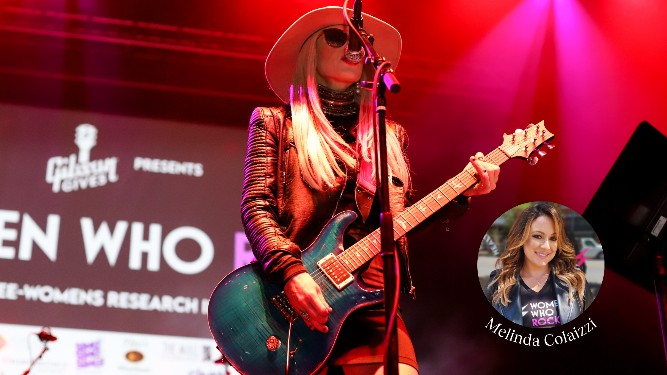 Female guitarist performs on stage under red and purple lighting, wearing a hat and leather jacket during the 'Women Who Rock' event, with an overlay of Melinda Colaizzi's headshot in the corner.